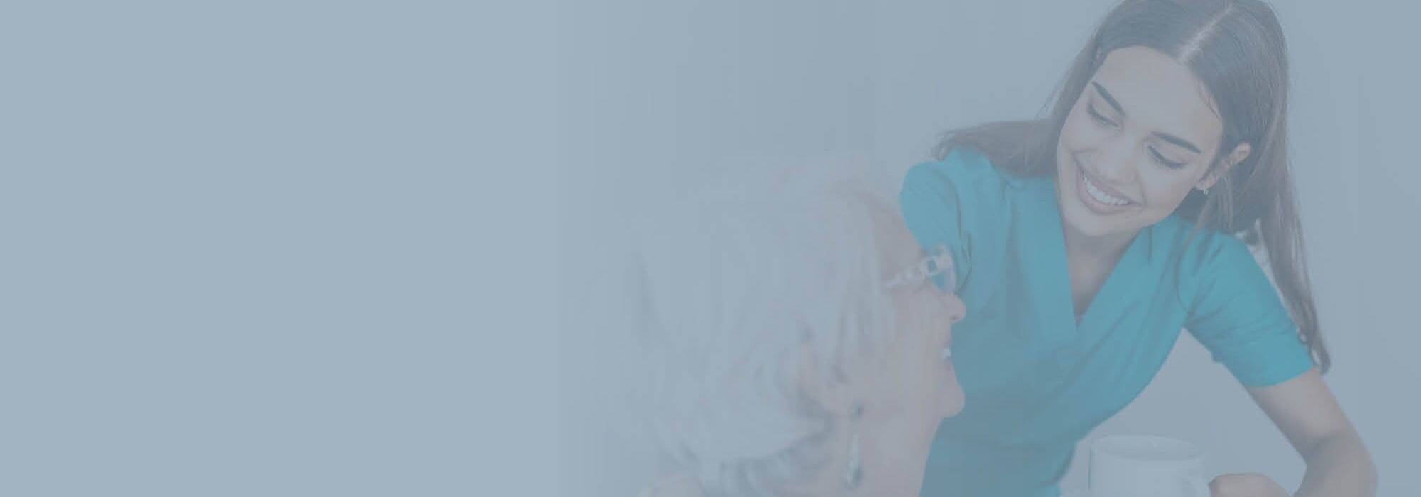Agency healthcare assistant smiling with patient