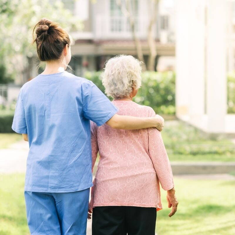 Healthcare worker assisting patient 